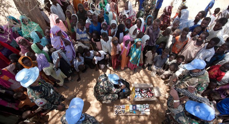 : Members of the Nepalese special forces serving with the Joint UN-African Union Mission in the Darfur region of Sudan (UNAMID) are pictured conducting a medical treatment campaign in the village of Kuma Garadayat in May 2011. The event was part of effort