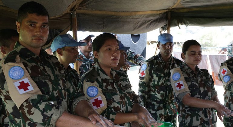 Nepalese peacekeepers in South Sudan conduct a handwash training at Queen’s Nursery School in the capital, Juba, in September 2018. They also distributed non-food items, including back packs for students, during the event.