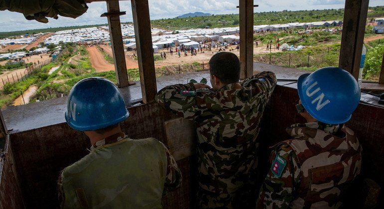 Members of the Nepalese battalion man a guard post that overlooks a protection-of-civilians site in Juba in May 2015. Nepalese forces help to protect civilians in South Sudan by patrolling across the country, facilitating the safe delivery of humanitarian aid and providing a secure environment for displaced people living in UN protection camps. 