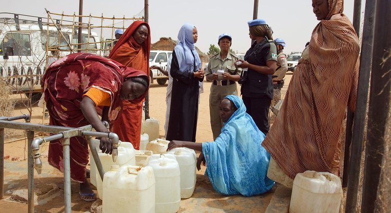 Members of the Formed Police Unit of the African Union-United Nations Hybrid Operation in Darfur from Ghana, Indonesia and Nigeria conduct daily patrols to monitor the security situation in the Zam Zam camp for internally displaced persons in April 2009.