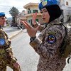 UNIFIL Malaysian peacekeeper, Major Syazwani, gives instructions to her fellow peacekeepers while patrolling in Rumaysh, south Lebanon in December 2017.