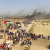 Drone shot, protesters walking towards the Gaza separation fence, with Israel. The anniversary of the "Great March of Return" protests, falls on 30 March, 2019.