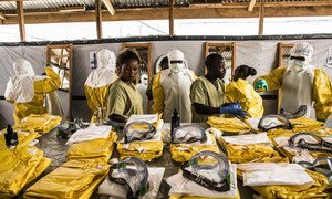 Health workers put on personal protective equipment (PPE) before entering an Ebola quarantine zone in the Democratic Republic of the Congo. (file)