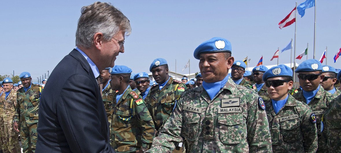 The chief of UN Peace Operations Jean-Pierre Lacroix (l) shakes hands with UNIFIL’s Malaysian contingent commander, Colonel Azhan bin Hj Md Othman in Chama, south Lebanon. (13 March 2019)