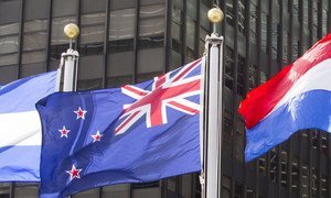 The flag of New Zealand (centre) flying at United Nations headquarters in New York.