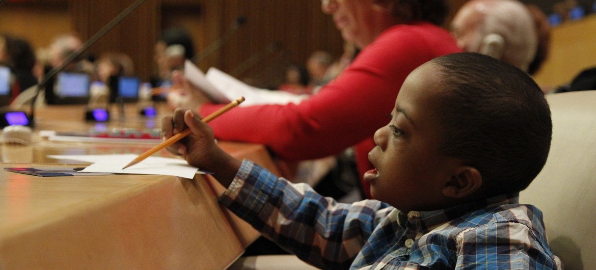Young children participate in a panel discussion on health and well-being at an event held on the occasion of World Down Syndrome Day at UN Headquarters.  (file)