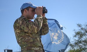 An UNFICYP peacekeeper takes part in a routine patrol along the buffer zone in Cyprus. 