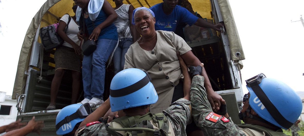 UN peacekeepers in Haiti support the relocation of people ahead of the arrival of a tropical storm. (file 2010)