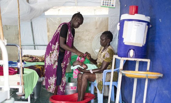 A newborn baby is getting a bath by it's grandmother at the UNICEF supported maternity ward in the POC in Malakal, South Sudan. .