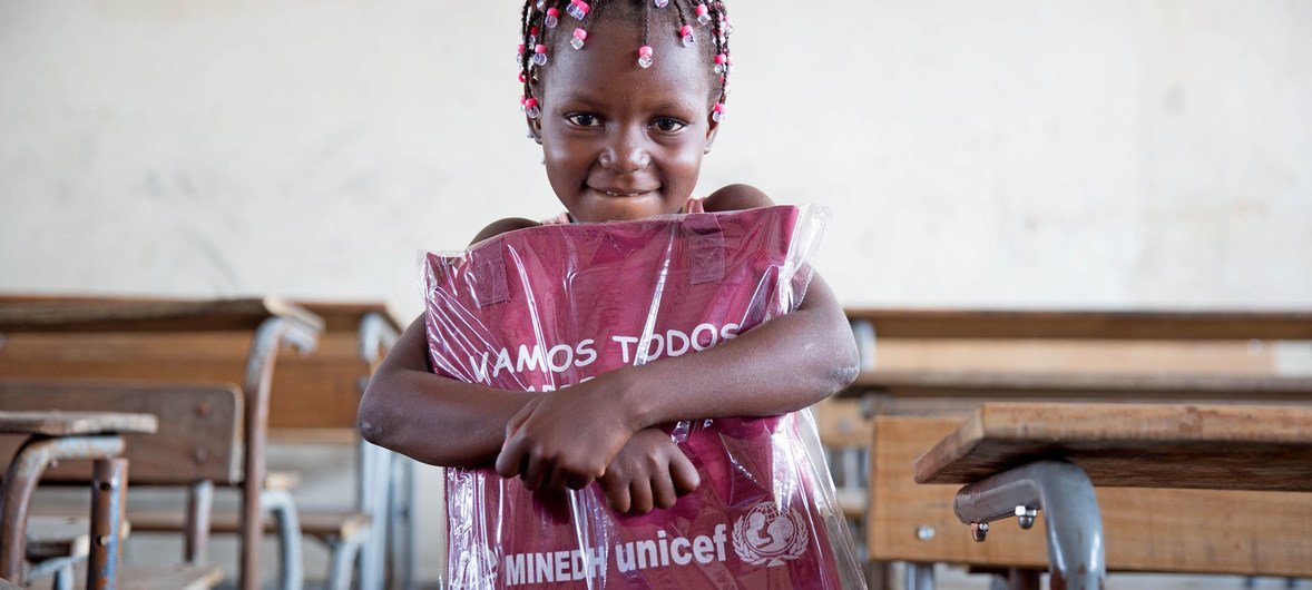 Six-year-old girl in Beira receives her education pack as part of UNICEF's ramped-up response to children and families in Mozambique affected by Cylcone Idai, April 2019.