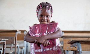 Six-year-old girl in Beira receives her education pack as part of UNICEF's ramped-up response to children and families in Mozambique affected by Cylcone Idai, April 2019.