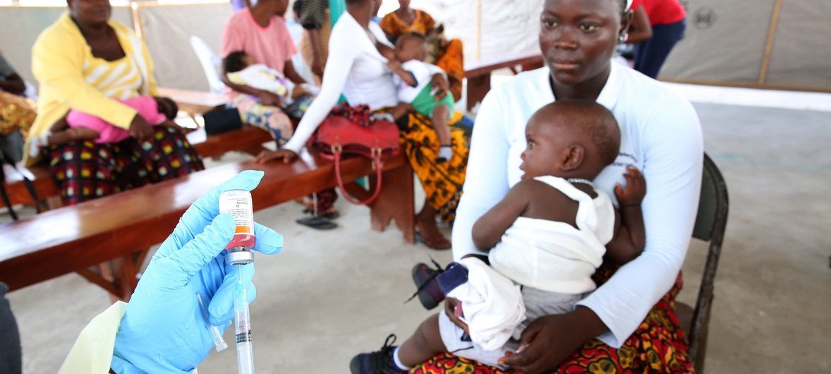 Nurse at Redemption Hospital in Monrovia, Liberia, prepares to vaccinate children.