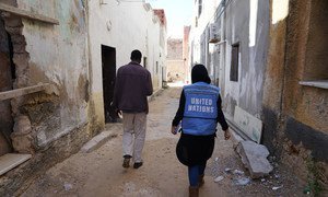 In the streets of Tripoli, Libya, a UNOCHA staff member visits a Sudanese caregiver's house, before the recent clashes began. (February 2019)