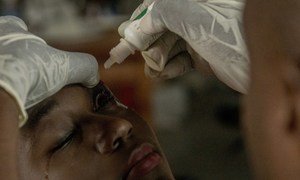 Centrine takes an eye test to see check for any complications following her survival from Ebola.