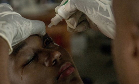 Centrine takes an eye test to see check for any complications following her survival from Ebola.