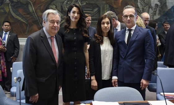 Secretary-General António Guterres (left) with (from left to right) Amal Clooney, Barrister; Nadia Murad, Nobel Peace Prize Laureate and Goodwill Ambassador for the Dignity of Survivors of Human Trafficking of the UN Office on Drugs and Crime (UNODC); and