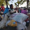 Families affected by the Cyclone Idai leave temporary shelter of IFAPA, in Beira, to a transit center closer to their places of origin in the district of Buzi, Mozambique (20 April 2019). 
