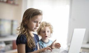 A 6 year-old and 4 year-old in front of a laptop, in the city of Podgorica, Montenegro, as part of the promotion of the “End Violence Online” campaign (2016)