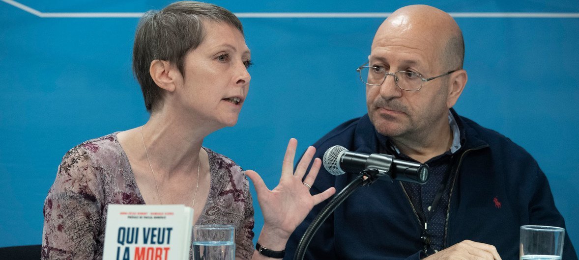 UN News chief Jérôme Longué speaks with author Anne-Cécile Robert (left) at a book launching event at the United Nations Headquarters.