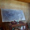 A child rests on a table in the classroom where her family is sleeping at a school used as a collective centre for internally displaced people in Oicha, Beni territory, North Kivu.