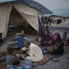 أسرة عراقية نازحة تتناول وجبة الإفطار في شهر رمضان، في مخيم للمشردين داخليا في كردستان العراق.