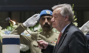 Secretary-General António Guterres lights a candle at the annual memorial service to honour United Nations personnel who have lost their lives in the line of duty since 1 January 2018, including fallen colleagues from the Funds and Programmes. (6 May 2019