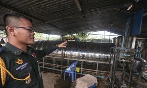 Colonel Channy Vongvannak, Commander of the Cambodian Force Military Police of UNMISS, inspects a water purification plant within the Cambodian quarters.