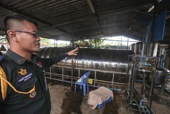 Colonel Channy Vongvannak, Commander of the Cambodian Force Military Police of UNMISS, inspects a water purification plant within the Cambodian quarters.