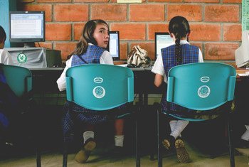 Two schoolgirls make use of classroom computers at San Jose, a rural secondary school in La Ceja del Tambo, Antioquia, Colombia. 