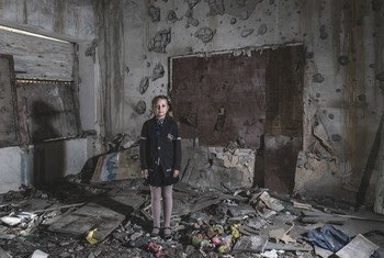 Masha Khromchenko stands in the kindergarten classroom that took a direct hit from a shell in the Luhansk region, Ukraine. (23 September 2018)