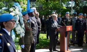 Secretary-General António Guterres (at podium) makes remarks during a wreath-laying ceremony honouring fallen peacekeepers in observance of the International Day of United Nations Peacekeepers (24 May 2019).