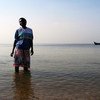 Oceans and seas are home to vast biodiversity.  A woman in Entebbe, is photographed on the shores of Lake Victoria, Uganda. 