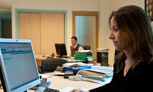 Woman working at her office at an export promotion agency.