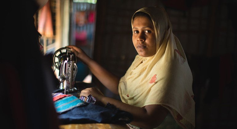 Narun Nahar sits at her sewing machine in Kutupalong refugee settlement. She fled Myanmar with her family, but her husband and father were killed on the way, leaving Narun and her mother widowed. She lives in Kutupalong refugee settlement with her two son