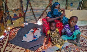 Farhia Mousa sits with three of her six children, including Nacima, 10-days-old, Abdulahi, 4-years-old, and Nasterha, 2-years-old, in a camp for people displaced by conflict and drought in Dangaroyo, Somalia. (22 May 2019)