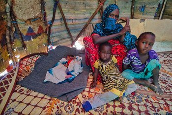 Farhia Mousa sits with three of her six children, including Nacima, 10-days-old, Abdulahi, 4-years-old, and Nasterha, 2-years-old, in a camp for people displaced by conflict and drought in Dangaroyo, Somalia. (22 May 2019)