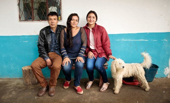 Cielo Gomez (center) and her family live in  Nariño territory, Colombia. She took a loan to by land.  