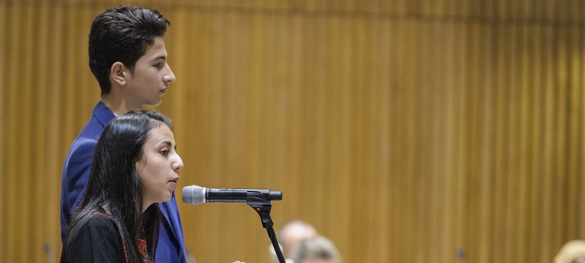 Hanan Abu Asbeh (foreground), a 15-year-old girl from the West Bank and 14-year-old Hatem Hamdouna from Gaza address delegates at the UN in New York about life as students in schools run by United Nations Relief and Works Agency for Palestine Refugees in 
