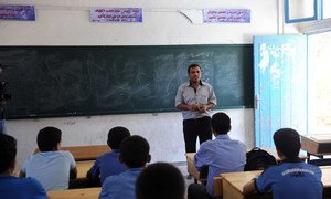 A teacher leads one of the first classes of the new academic year, at a school in Gaza supported by the United Nations Relief and Works Agency for Palestine Refugees in the Near East (UNRWA).