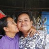 Changing families give rise to needed policy changes. Sao Mimol kisses her partner in Cambodia during an LGBT Pride event. (file)