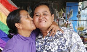 Changing families give rise to needed policy changes. Sao Mimol kisses her partner in Cambodia during an LGBT Pride event.