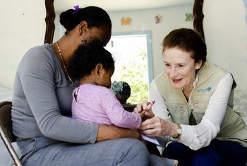 In Tijuana, Mexico, UNICEF Executive Director Henrietta Fore meets with a young mother and her child who fled their home town in Mexico after facing extortion threats. (June 2019)