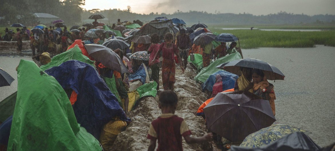 Rohingya refugees fleeing conflict and persecution in Myanmar.