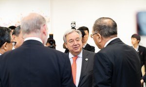 UN Secretary-General António Guterres at the G-20 summit in Japan in 2019.  He is shown at the Climate Change Trilateral Meeting with HE Mr. Jean-Yves Le Drian, Foreign Minister of France and HE Mr. Wang Yi, Foreign Minister of China