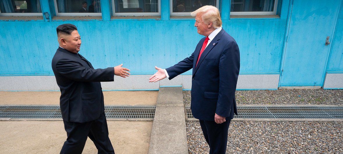 US President Donald Trump shakes hands with the Chairman of the Workers’ Party of Korea Kim Jong-un as the two leaders meet at the Korean Demilitarized Zone which separates North and South Korea on 30 June 2019.