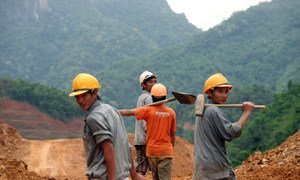 Construction workers at the Trung Son Hydropower project construction site, Vietnam.