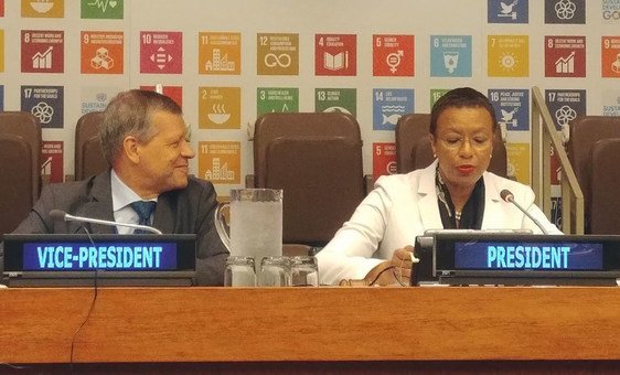 Seated at the podium of the High-level Political Forum, from left are Valentin Rybakov, Vice President of Economic and Social Council, and Inga Rhonda King, President of Economic and Social Council. (9 July 2019)