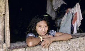 A woman from a low-income neighbourhood in Brazil, photographed at her window. The 2019 Multidimensional Poverty Index shows vast inequalities within countries.