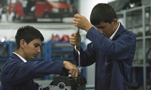 Students work on an engine at Sisli Vocational High School in Istanbul, Turkey.