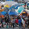 Asylum-seekers queue for a meal at El Barretal shelter in Tijuana, Mexico. (4 December 2018)